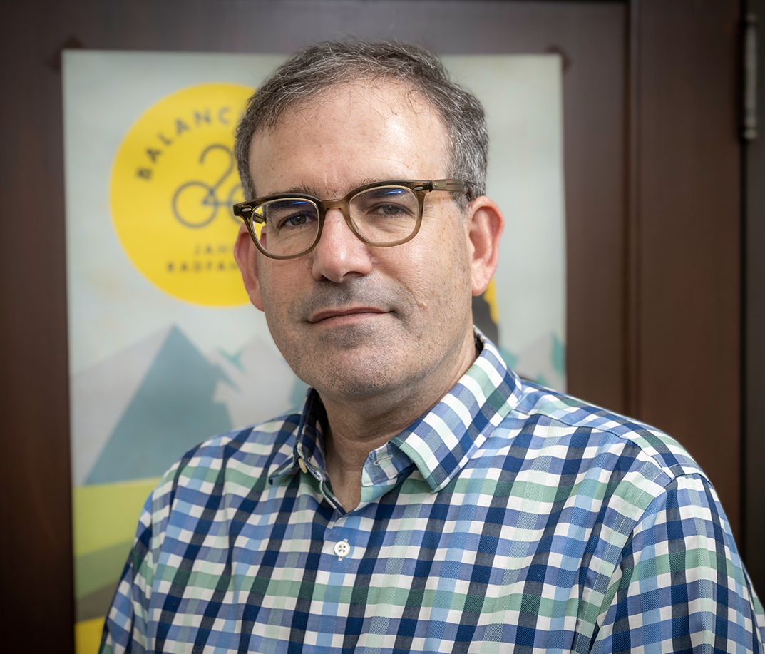 Dan Stamper Kurn wearing a plaid shirt of course