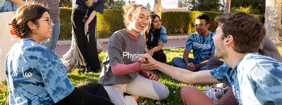 Students smiling and interacting on the campanile esplanade grounds