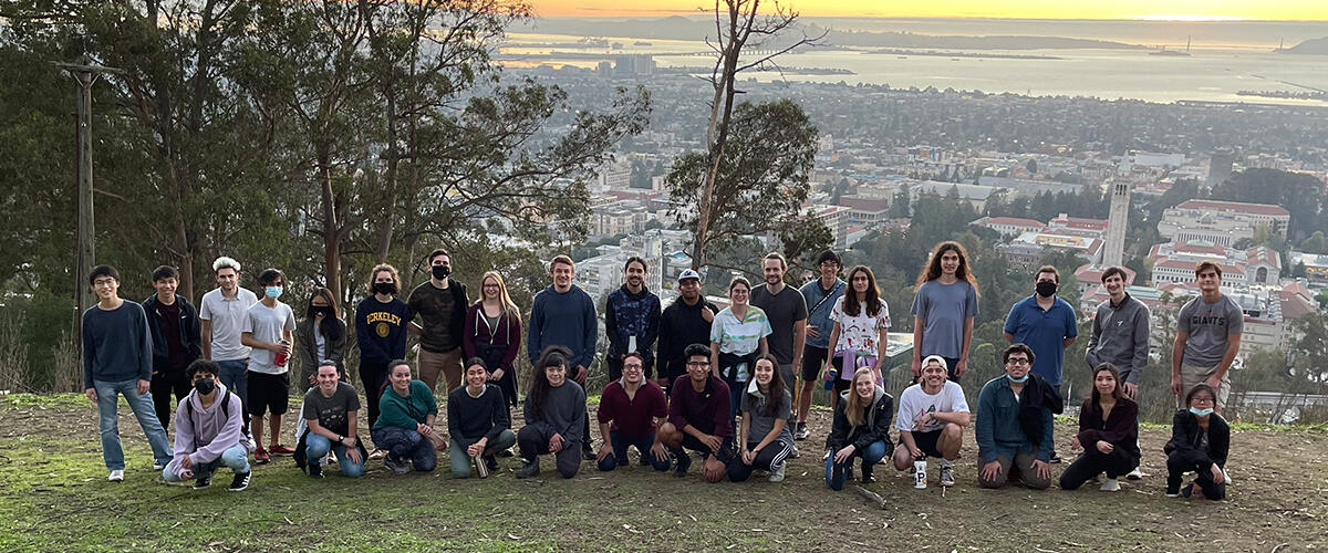 Students standing along a ridge in the Berkeley Hills overlooking the Bay