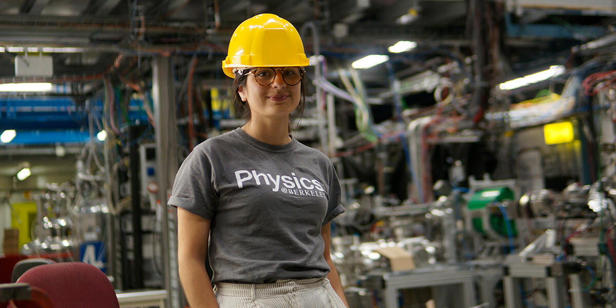 Student in hardhat at an experiment site