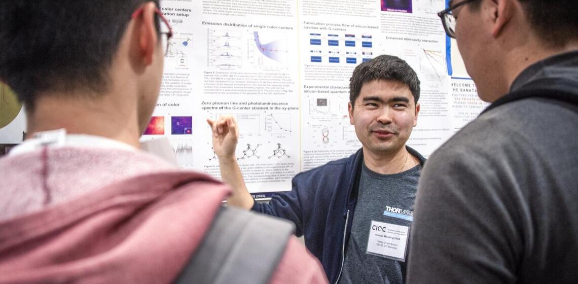 Man explaining scientific poster