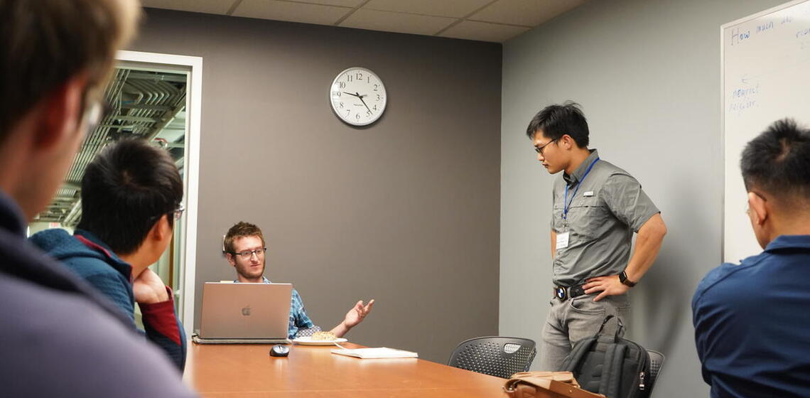 Student asking question to grad student