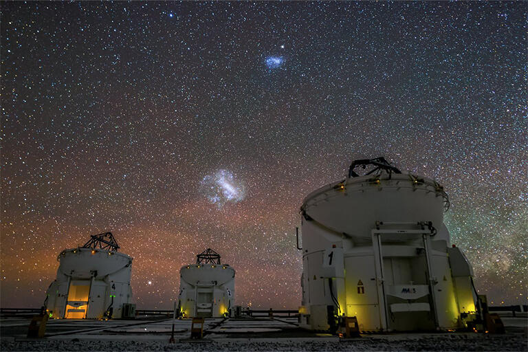 Telescopes viewing Magellanic Clouds in the night sky