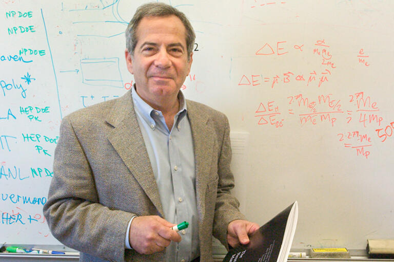 Stuart Freedman in front of a dry erase board